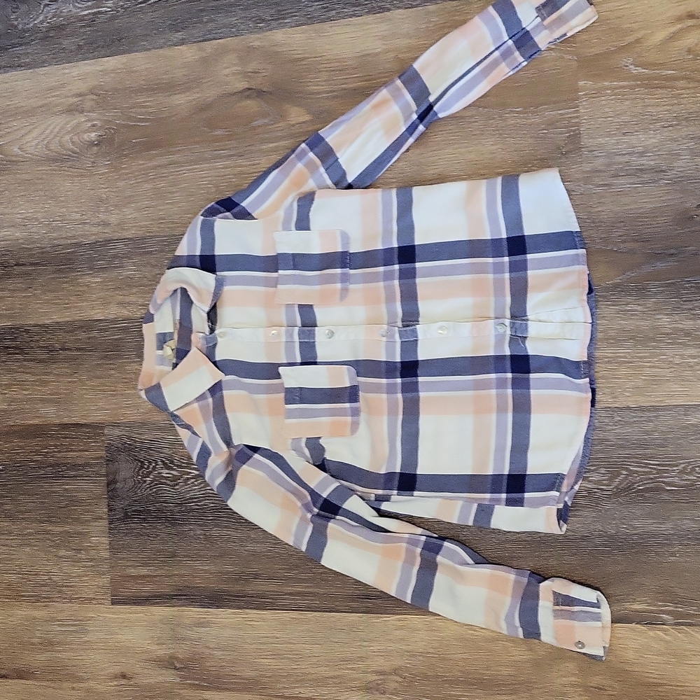 A child's medium pink and blue plaid t-shirt.